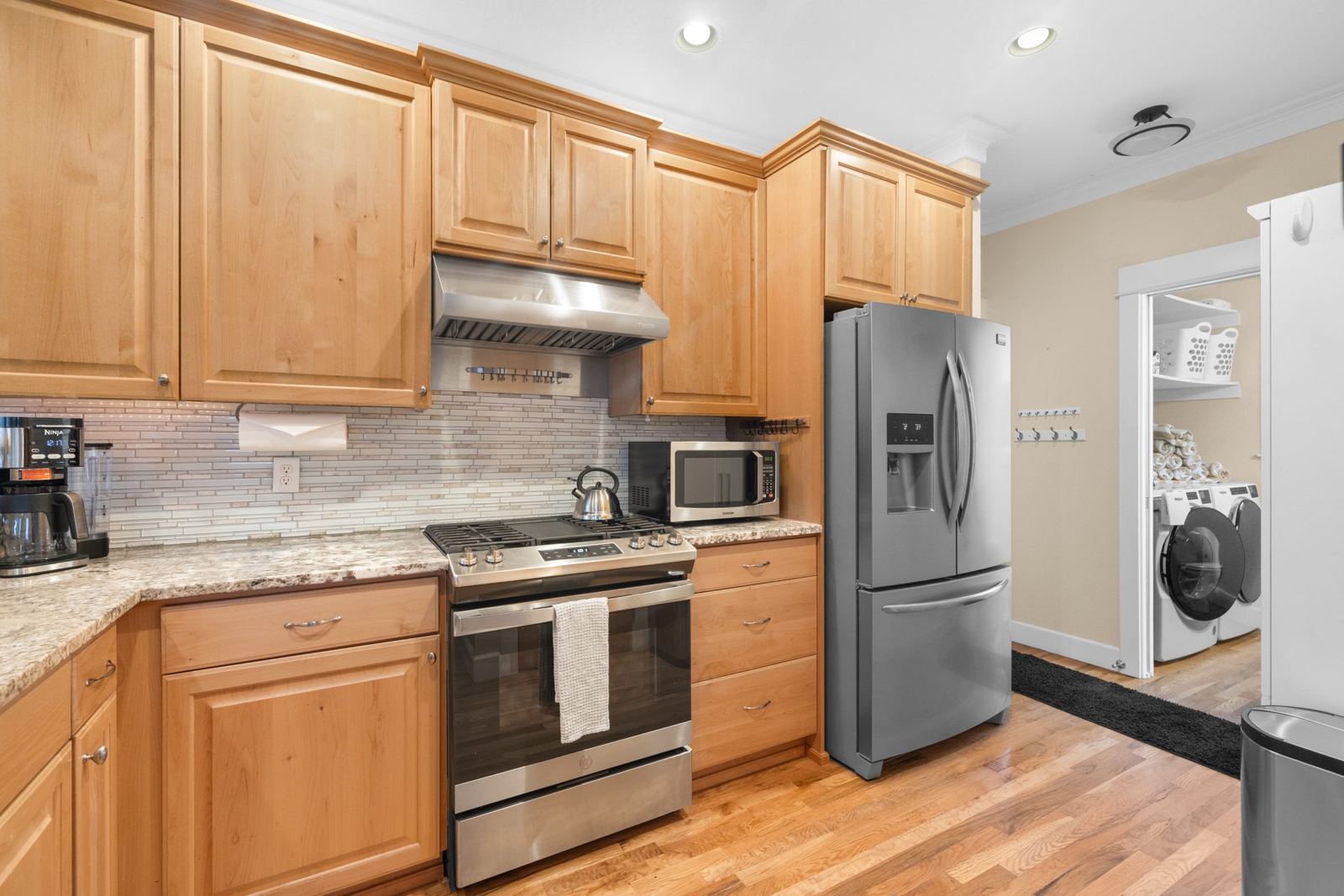 Kitchen with gas range and stainless appliances